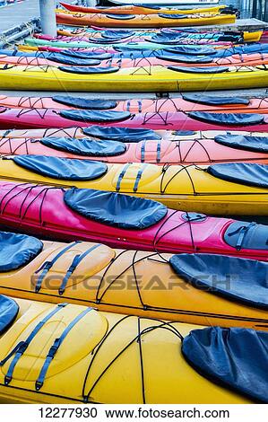 Stock Image - View of colorful kayaks tied to the harbor dock in Valdez, Southcentral Alaska, Summer. Fotosearch