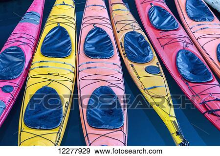 View of colorful kayaks tied to the harbor dock in Valdez, Southcentral Alaska, Summer View Large Photo Image Stock Photo - View of colorful kayaks tied to the harbor dock in Valdez, Southcentral Alaska, Summer. Fotosearch