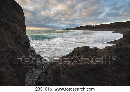 Stock Photography - Waves Hit The Shoreline At Djupalonsanndur On The Snaefellsnes Peninsula; Iceland. Fotosearch