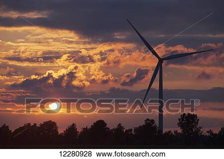 Stock Photo - Wind turbine at sunset, West of Comber; Ontario, Canada. Fotosearch