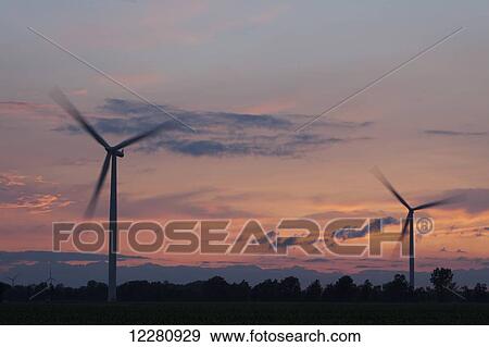 Stock Photo - Wind turbine at sunset, West of Comber; Ontario, Canada. Fotosearch