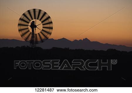 Windmill at sunset; South Africa View Large Photo Image Stock Photo - Windmill at sunset; South Africa. Fotosearch