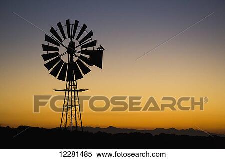Windmill at sunset; South Africa View Large Photo Image Stock Photography - Windmill at sunset; South Africa. Fotosearch