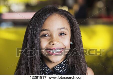 Young girl smiling for a portrait in a cafeteria at a shopping mall; St. Albert, Alberta, Canada View Large Photo Image Stock Photo - Young girl smiling for a portrait in a cafeteria at a shopping mall; St. Albert, Alberta, Canada. Fotosearch