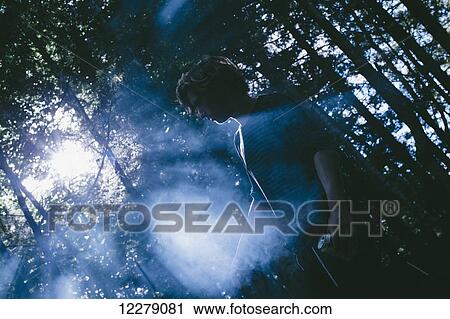 Young man standing in the fog in a forest, Little River State Park; Waterbury, Vermont, United States of America View Large Photo Image Stock Image - Young man standing in the fog in a forest, Little River State Park; Waterbury, Vermont, United States of America. Fotosearch