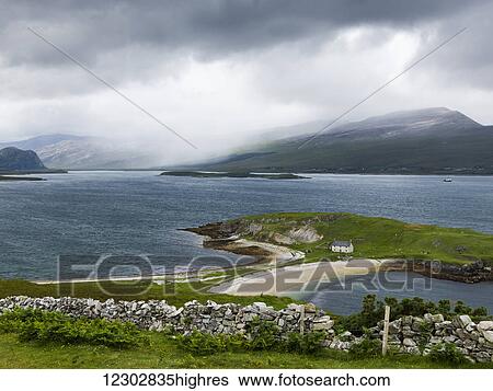 A beach and green landscape with low clouds over the mountains in the distance; Scotland View Large Photo Image Stock Photograph - A beach and green landscape with low clouds over the mountains in the distance; Scotland. Fotosearch
