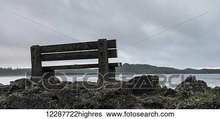 A bench sits on the rocks at the water's edge, Pacific Rim National Park; Tofino, British Columbia, Canada View Large Photo Image Stock Photograph - A bench sits on the rocks at the water's edge, Pacific Rim National Park; Tofino, British Columbia, Canada. Fotosearch