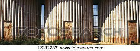 Stock Photo - A close up view of three rusted grain silos in Coachella Valley; Mecca, California, United States of America. Fotosearch