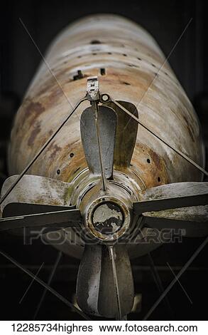 Stock Photograph - A deactivated torpedo is laid to rest on a busy street; Stockholm, Sweden. Fotosearch