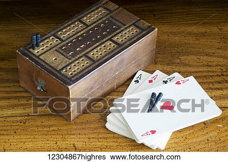 A deck of cards and a board game; Chilliwack, British Columbia, Canada View Large Photo Image Stock Photograph - A deck of cards and a board game; Chilliwack, British Columbia, Canada. Fotosearch