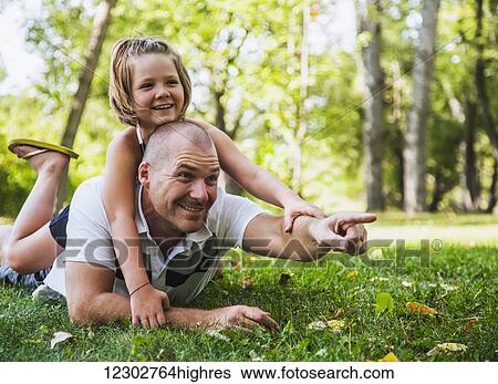 A father spending quality time with his daughter in a park during a family outing; Edmonton, Alberta, Canada View Large Photo Image Stock Photograph - A father spending quality time with his daughter in a park during a family outing; Edmonton, Alberta, Canada. Fotosearch