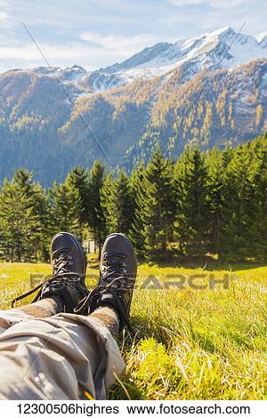 A hiker in the swiss alps; San Bernardino, Grisons, Switzerland View Large Photo Image Stock Photograph - A hiker in the swiss alps; San Bernardino, Grisons, Switzerland. Fotosearch