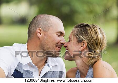 A husband and wife kissing in a park; Edmonton, Alberta, Canada View Large Photo Image Stock Photograph - A husband and wife kissing in a park; Edmonton, Alberta, Canada. Fotosearch