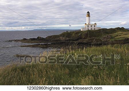 Stock Photograph - A lighthouse along the coast; Scotland. Fotosearch