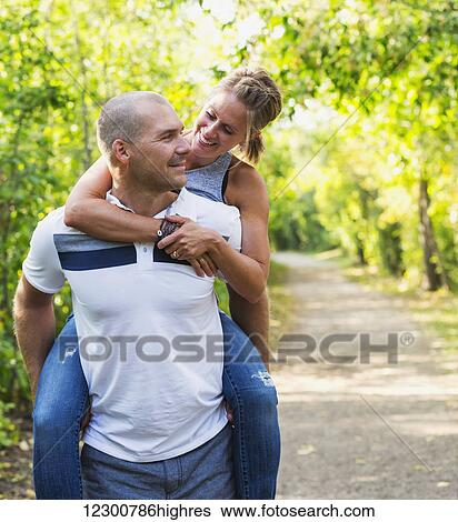 A married couple spending quality time together in a park during a family outing; Edmonton, Alberta, Canada View Large Photo Image Stock Photograph - A married couple spending quality time together in a park during a family outing; Edmonton, Alberta, Canada. Fotosearch