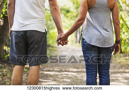 A married couple spending quality time together walking in a park; Edmonton, Alberta, Canada View Large Photo Image Stock Photograph - A married couple spending quality time together walking in a park; Edmonton, Alberta, Canada. Fotosearch