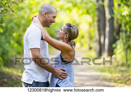 Stock Photograph - A married couple spending quality time together in a park; Edmonton, Alberta, Canada. Fotosearch