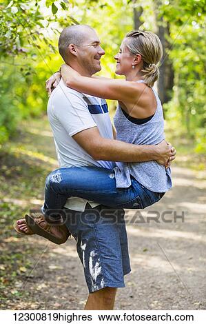 A married couple spending quality time together in a park; Edmonton, Alberta, Canada View Large Photo Image Stock Photograph - A married couple spending quality time together in a park; Edmonton, Alberta, Canada. Fotosearch