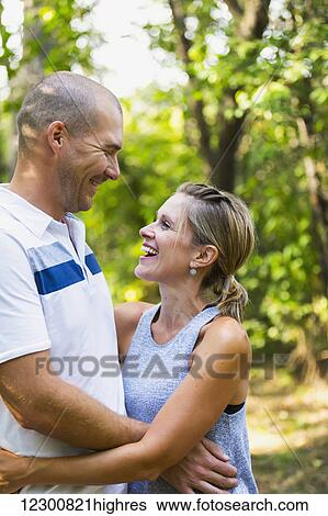 Stock Photograph - A married couple spending quality time together in a park; Edmonton, Alberta, Canada. Fotosearch