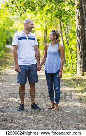 A married couple spending quality time together in a park; Edmonton, Alberta, Canada View Large Photo Image Stock Photograph - A married couple spending quality time together in a park; Edmonton, Alberta, Canada. Fotosearch