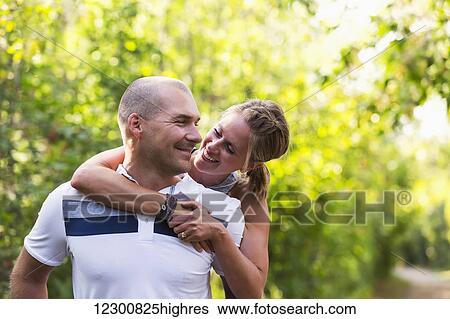 Stock Photograph - A married couple spending quality time together in a park; Edmonton, Alberta, Canada. Fotosearch