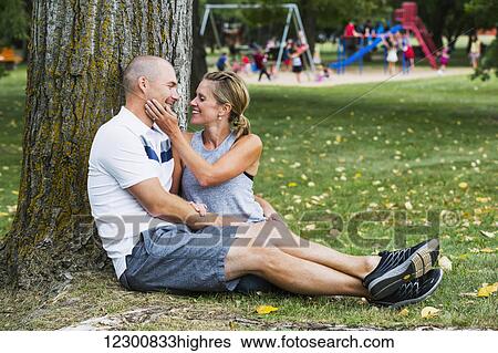 A married couple spending quality time together in a park; Edmonton, Alberta, Canada View Large Photo Image Stock Photograph - A married couple spending quality time together in a park; Edmonton, Alberta, Canada. Fotosearch
