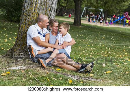 A married couple spending quality time with their son in a park during a family outing; Edmonton, Alberta, Canada View Large Photo Image Stock Photograph - A married couple spending quality time with their son in a park during a family outing; Edmonton, Alberta, Canada. Fotosearch