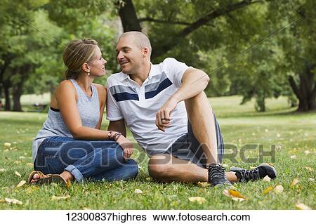 Stock Photograph - A married couple spending quality time together in a park; Edmonton, Alberta, Canada. Fotosearch