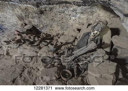 Stock Image - A mummy lays in silence within a cave near the Salar de Uyuni; Bolivia. Fotosearch