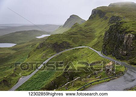 A road winding through the mountains, Highlands; Staffin, Scotland View Large Photo Image Stock Photograph - A road winding through the mountains, Highlands; Staffin, Scotland. Fotosearch