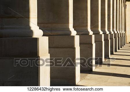 A row of pillars at Palais Royal form an interesting pattern; Paris, France View Large Photo Image Stock Photograph - A row of pillars at Palais Royal form an interesting pattern; Paris, France. Fotosearch