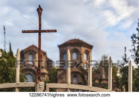 A rusty cross on a gate in front of a church; Thessaloniki, Greece View Large Photo Image Stock Photograph - A rusty cross on a gate in front of a church; Thessaloniki, Greece. Fotosearch