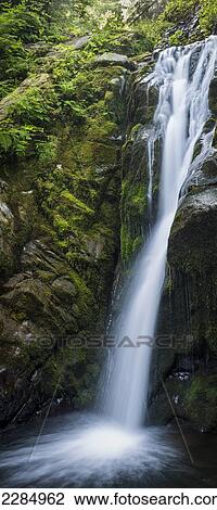 Stock Image - A secluded waterfall is found on Necarney Creek; Manzanita, Oregon, United States of America. Fotosearch