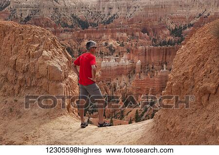 A senior man hikes overlooking Bryce Canyon National Park; Utah, United States View Large Photo Image Stock Photograph - A senior man hikes overlooking Bryce Canyon National Park; Utah, United States. Fotosearch