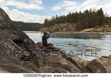 A senior man watches the tides at Dodds Narrows on Vancouver Island; British Columbia, Canada View Large Photo Image Stock Photograph - A senior man watches the tides at Dodds Narrows on Vancouver Island; British Columbia, Canada. Fotosearch