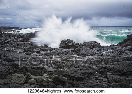 A wave splashes against the rocks on Iceland's southern coast; Iceland View Large Photo Image Stock Photograph - A wave splashes against the rocks on Iceland's southern coast; Iceland. Fotosearch