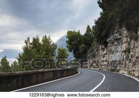 Stock Photograph - A winding road along the Amalfi coast; Praiano, Campania, Italy. Fotosearch