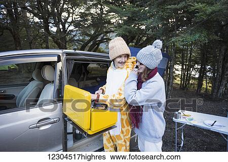A young couple camping and keeping warm at Mavora Lake; Mavora, Southland, New Zealand View Large Photo Image Stock Photograph - A young couple camping and keeping warm at Mavora Lake; Mavora, Southland, New Zealand. Fotosearch
