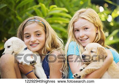 Adorable Cute Young Girls with Puppies View Large Photo Image Stock Photograph - Adorable Cute Young Girls with Puppies. Fotosearch