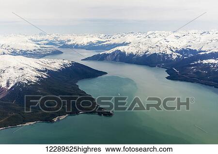 Aerial view of a glacier fjord in the Inside Passage, and snow capped peaks, Wrangell, Southeast Alaska, USA, Spring View Large Photo Image Stock Photograph - Aerial view of a glacier fjord in the Inside Passage, and snow capped peaks, Wrangell, Southeast Alaska, USA, Spring. Fotosearch