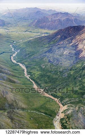 Aerial view of a river cutting through a valley in the Brooks Range; Alaska, United States of America View Large Photo Image Stock Photograph - Aerial view of a river cutting through a valley in the Brooks Range; Alaska, United States of America. Fotosearch