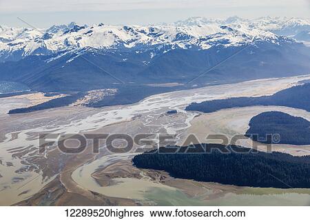 Stock Photograph - Aerial view of low tide and Woronkofski Island in the Stikine River Delta on a clear day, Wrangell, Southeast Alaska, USA, Spring. Fotosearch