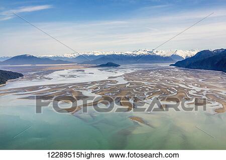 Stock Photograph - Aerial view of low tide in the Stikine River Delta on a clear day, Wrangell, Southeast Alaska, USA, Spring. Fotosearch