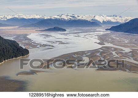 Stock Photograph - Aerial view of low tide in the Stikine River Delta on a clear day, Wrangell, Southeast Alaska, USA, Spring. Fotosearch