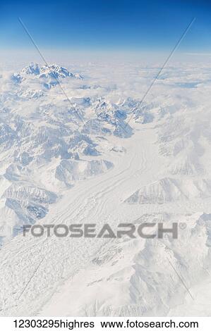 Stock Photograph - Aerial view of Mt. McKinley (Denali) covered in snow with the Buckskin Glacier running into the foreground, Interior Alaska, USA, Winter. Fotosearch