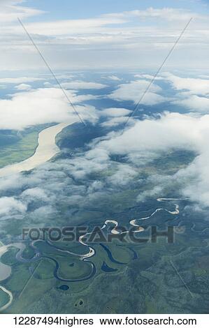Aerial view of patchy clouds over the Yukon River; Alaska, United States of America View Large Photo Image Stock Photograph - Aerial view of patchy clouds over the Yukon River; Alaska, United States of America. Fotosearch