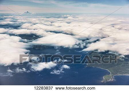Aerial View of Popof Island, low altitude clouds obscuring the Island, Sand Point, Southwestern Alaska, USA, Summer View Large Photo Image Stock Photo - Aerial View of Popof Island, low altitude clouds obscuring the Island, Sand Point, Southwestern Alaska, USA, Summer. Fotosearch