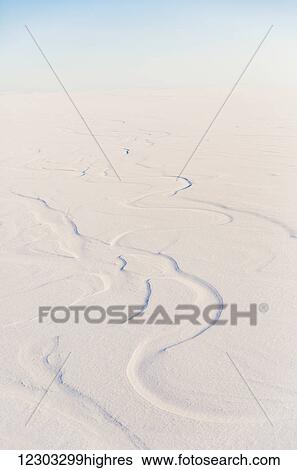 Stock Photograph - Aerial view of snow drifted into patterns by the wind, North Slope, Arctic Alaska, USA, Winter. Fotosearch