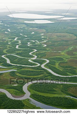 Stock Photograph - Aerial view of winding creek in Bristol Bay area, Southwest Alaska; Alaska, United States of America. Fotosearch