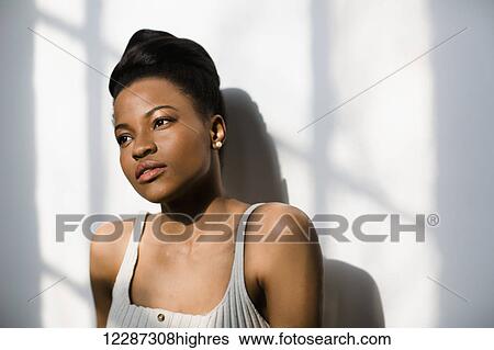 African Canadian woman leaning against wall; Toronto, Ontario, Canada View Large Photo Image Stock Photograph - African Canadian woman leaning against wall; Toronto, Ontario, Canada. Fotosearch